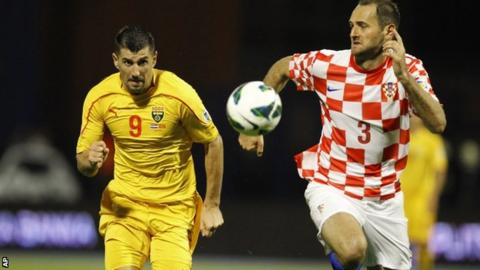 Macedonia"s Stevica Ristic (left) in action against Croatia