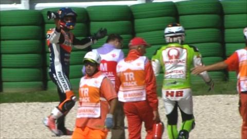 Dani Pedrosa walks away from his collision with Hector Barbera.