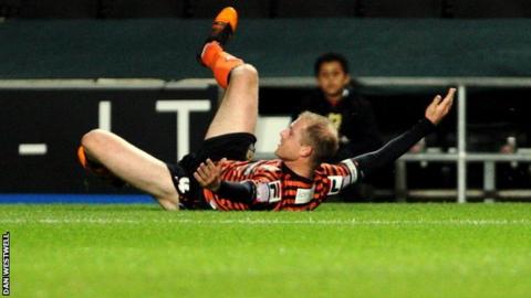 Neal Bishop celebrates his first-half goal against MK Dons