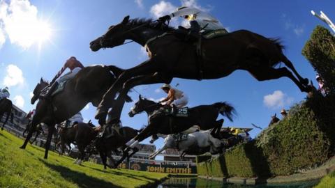 Unowatimeen ridden by Samantha Drake jumps the water jump during the Fox Hunters Steeple chase