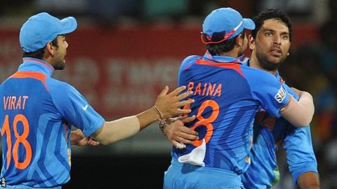 Yuvraj Singh celebrates taking a South African wicket with team-mates