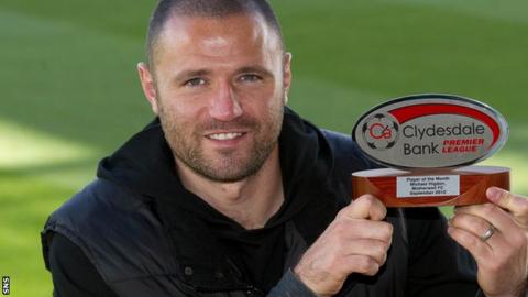 Motherwell striker Michael Higdon with his Clydesdale Bank award