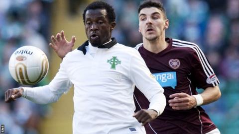 Celtic defender Efe Ambrose (left) holds off Callum Paterson