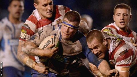 Stuart Dickens (centre) playing against Wigan