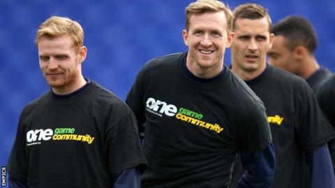 Players from Championship side Birmingham wear Kick It Out T-shirts