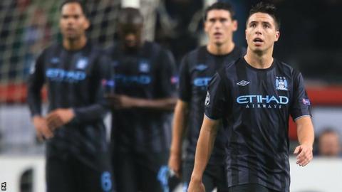 Manchester City's players stand dejected after Ajax's second goal