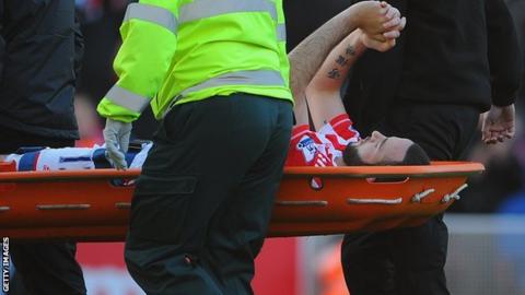 Marc Wilson is stretchered off