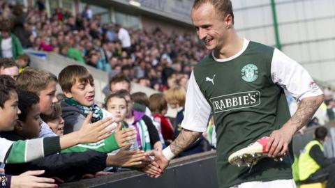 Hibs striker Leigh Griffiths greets the fans at Easter Road