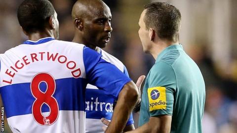 Jason Roberts of Reading talks to referee Kevin Friend during the Capital One Cup Fourth Round match between Reading and Arsenal