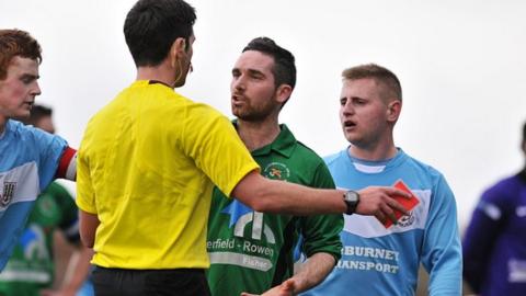 Jason McCartney is shown the red card against Ballymena