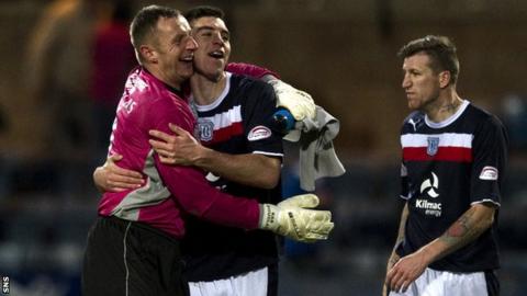 Goalkeeper Rab Douglas congratulates defender Declan Gallagher