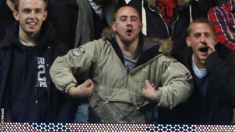 Fan in alleged racist gesture