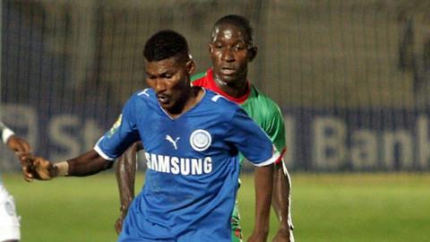 Al-Hilal's Haitham Karar (left) controls the ball next to Djoliba AC's Salif Coulibaly during their Confederation Cup semi-final first leg