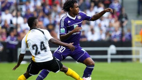 Patosi (left) playing for Lokeren against Anderlecht