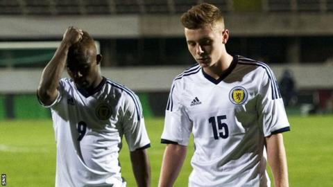Islam Feruz and Lewis MacLeod look dejected