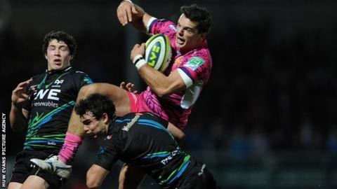 Osprey Tom Habberfield tackles Exeter's Mark Foster