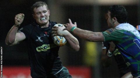 Pat Leach is about to be halted, but he goes on to score the game's opening try for the Dragons