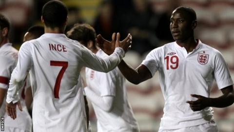 England's Benik Afobe (right) celebrates scoring with team-mate Tom Ince