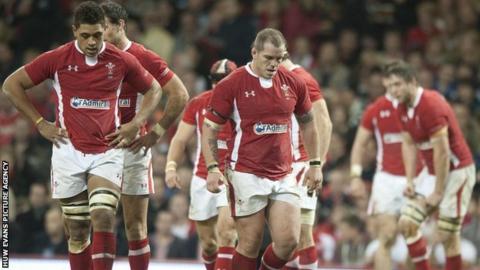 Wales players trudge off the field after defeat to New Zealand