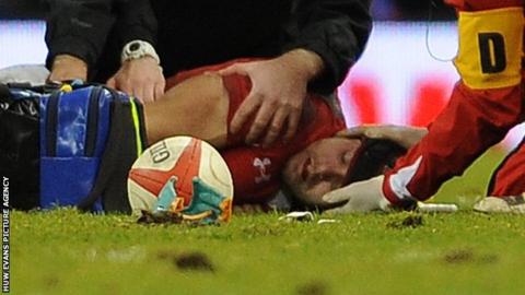 Leigh Halfpenny receives treatment on the field
