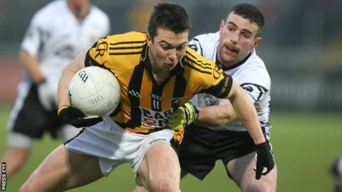 Crossmaglen's Stephen Kernan is challenged by Donal Kane