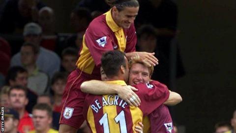 Stuart McCall congratulated by Peter Beagrie and Benito Carbone after scoring against Arsenal