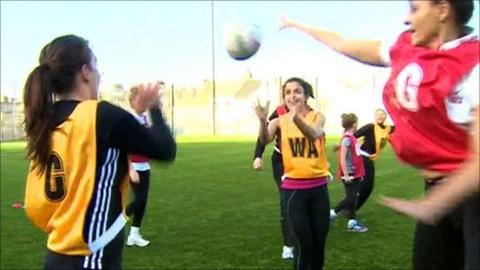 Girls playing netball