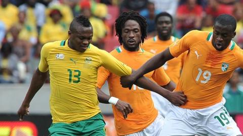 Kagisho Dikgacoi (left)