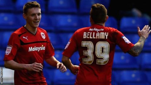 Joe Mason is congratulated by Craig Bellamy