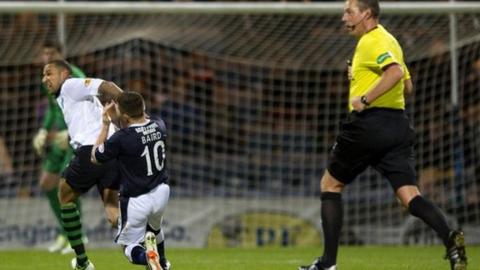 Kelvin Wilson clashes with John Baird
