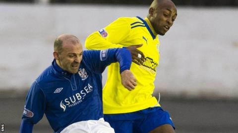 Cowdenbeath's Colin Cameron tussles with Morton's Fouad Bachirou