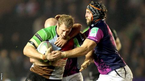 Chris Robshaw is tackled by Adrian Flavin and John Muldoon during the game in October