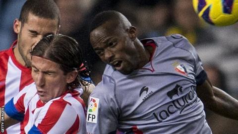 Roland Lamah (right)