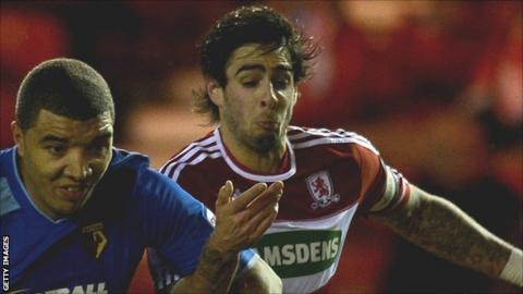 Rhys Williams and Troy Deeney (left) tussle