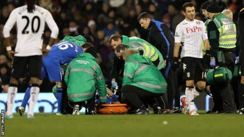 Wigan Athletic defender Ivan Ramis receives treatment for his knee injury at Fulham