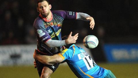 Mike Poole loses possession under pressure from Andrea Masi