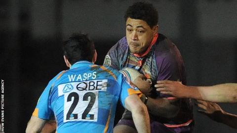 Toby Faletau takes on Stephen Jones