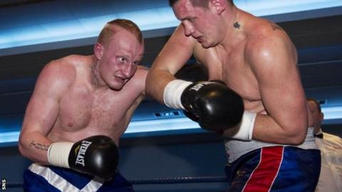 Gary Cornish trades blows with Hungarian fighter Tamas Bajzath
