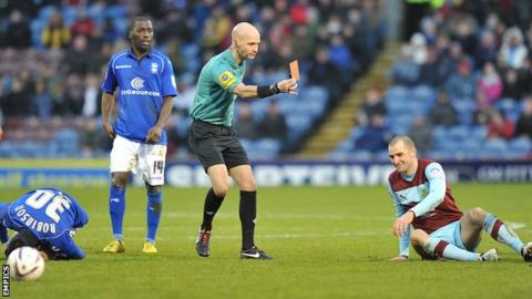 Burnley's Dean Marney is shown a red card against Birmingham