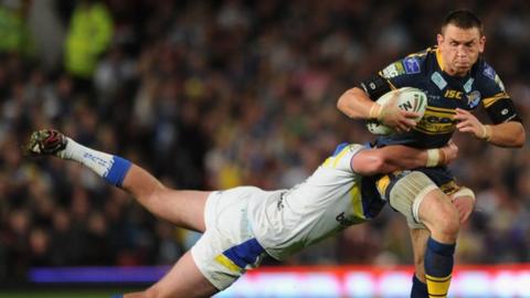 Kevin Sinfield is tackled by Trent Waterhouse