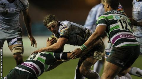 Cardiff Blues' Thomas Young is tackled by Jonathan Joseph