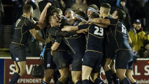 Scotland celebrate on the final whistle at Netherdale