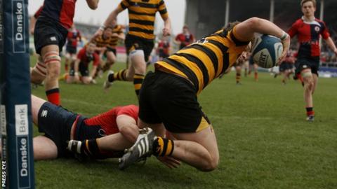 Iain Jones goes over for a RBAI try against Ballyclare