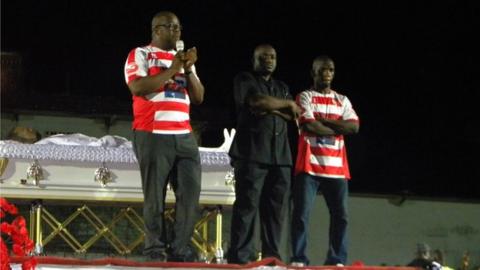 LFA President Musa Hassan Bility in black suit flanked by Former LFA President Edwin Snowe and Former Lone Star Ace midfielder Kelvin Sebwe