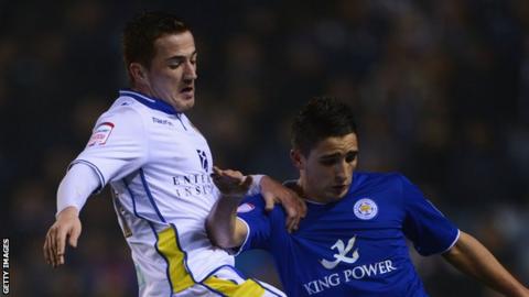 Ross McCormack of Leeds United battles with Anthony Knockaert of Leicester City