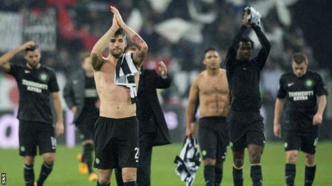 Charlie Mulgrew and his Celtic team-mates clap the supporters in Turin