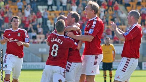 Wrexham players celebrate a goal