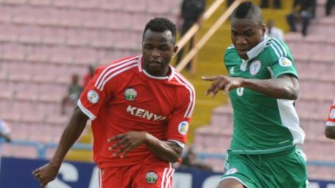 Kenya forward Johanna Ochieng (left) vies for the ball with Nigeria defender Ideye Brown