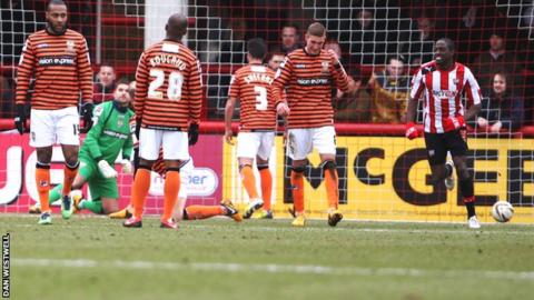Notts County's players look crestfallen after conceding he opening goal against Brentford at Griffin Park