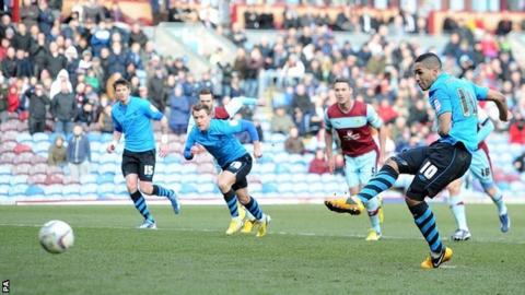 Lewis McGugan scores